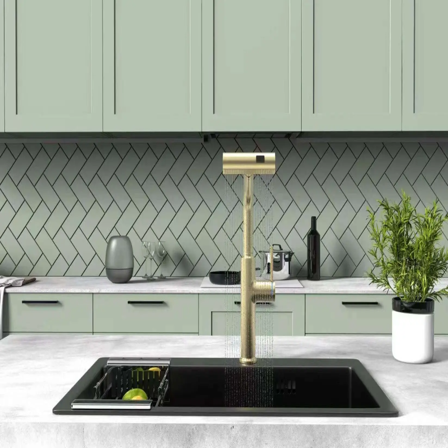Modern kitchen with a gold faucet and green cabinets